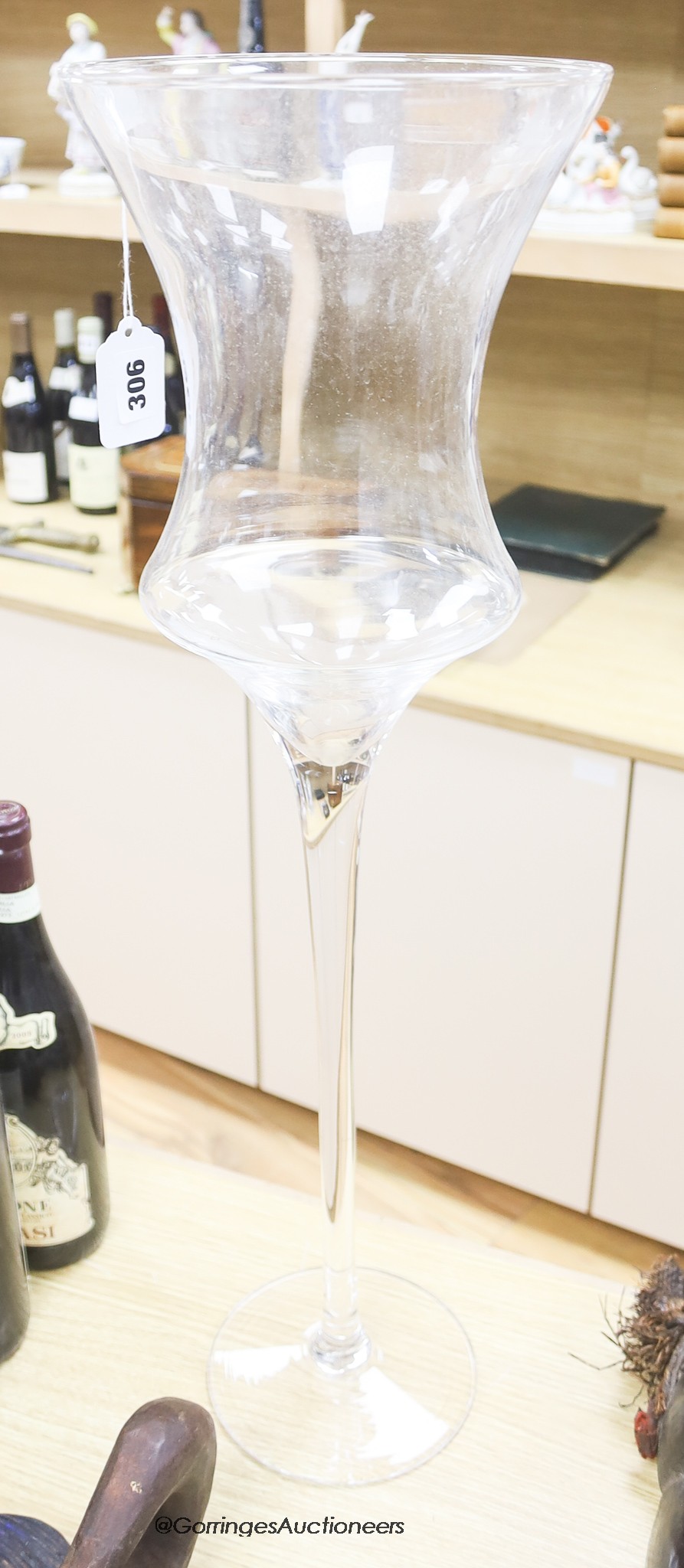 A tall glass stemmed vase / candle holder, height 69cm